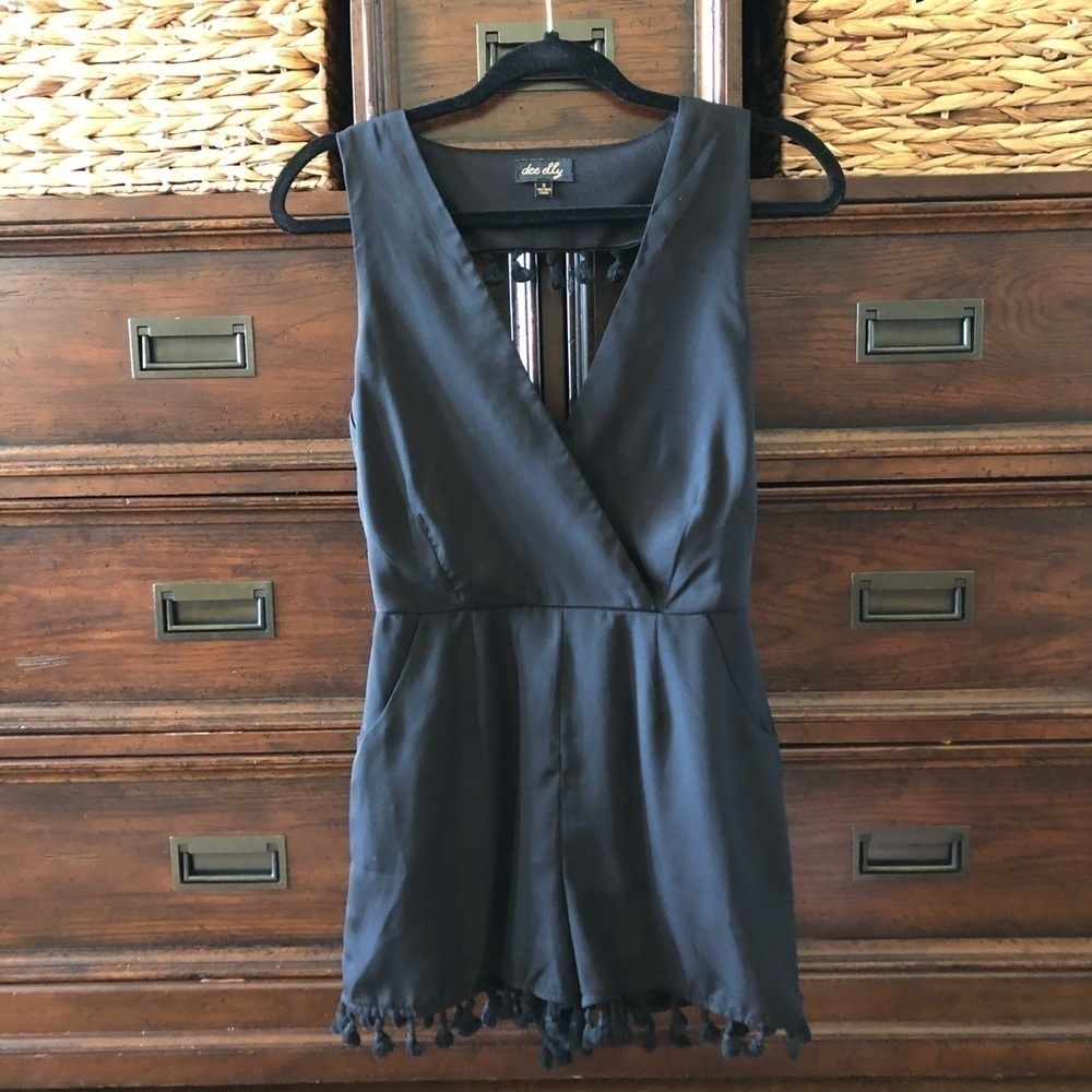 Dee Elly black sleeveless open cutout back v-neck pom pom romper in size S